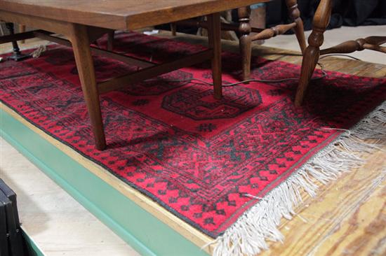 Appraisal: ORIENTAL STYLE AREA RUG Deep red ground with multiple borders