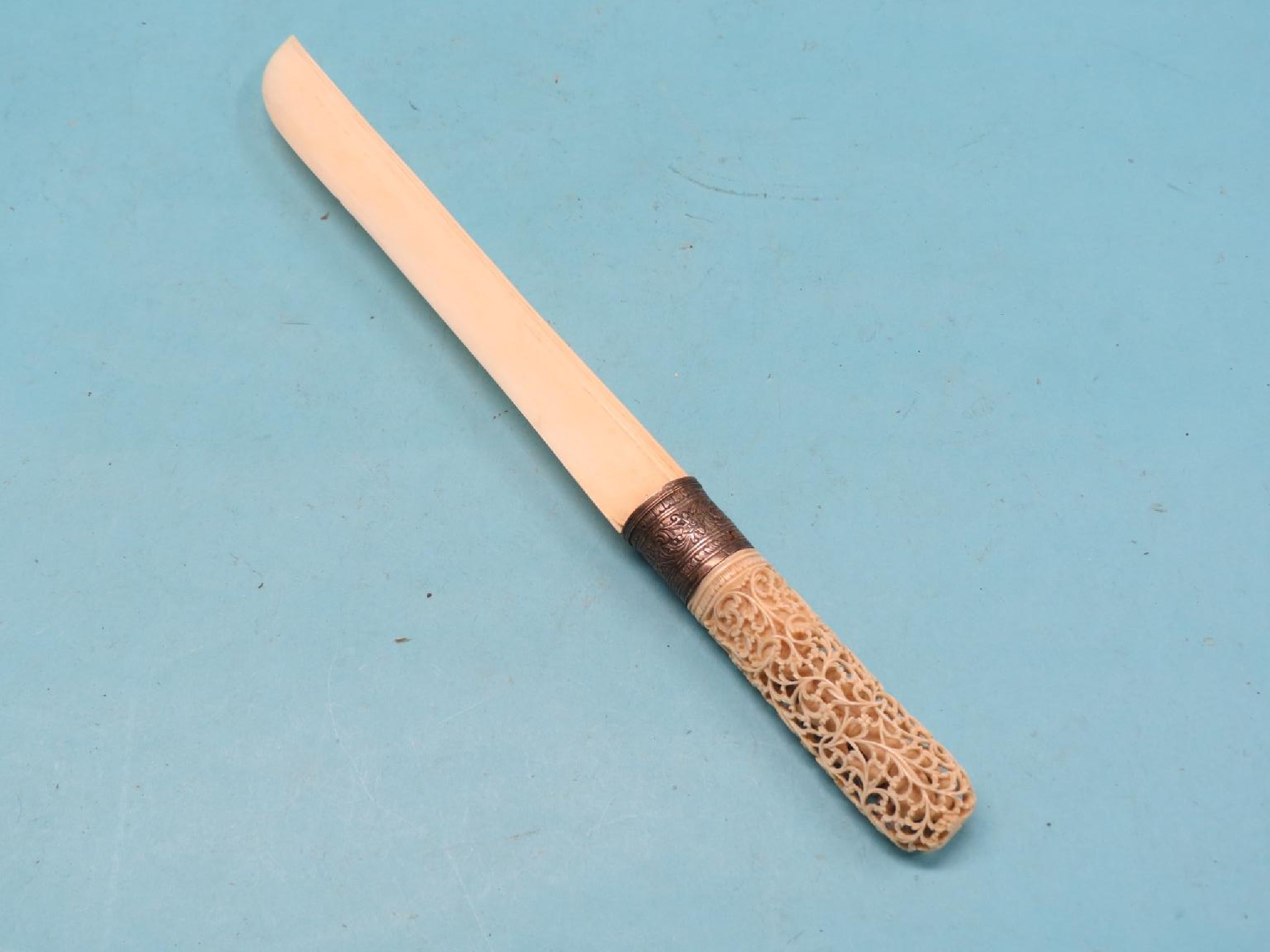 Appraisal: A th century Chinese ivory paperknife handle finely carved with