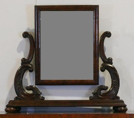 Appraisal: A Victorian toilet mirror on scroll support on a rectangular