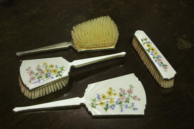 Appraisal: A FOUR PIECE DRESSING TABLE SET comprising three brushes and