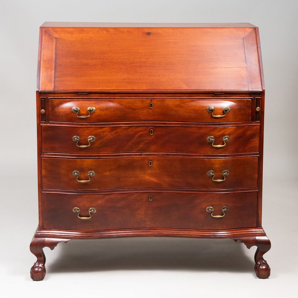 Appraisal: Chippendale Style Mahogany Oxbow Slant-Front Desk Massachusetts The slant-front opening