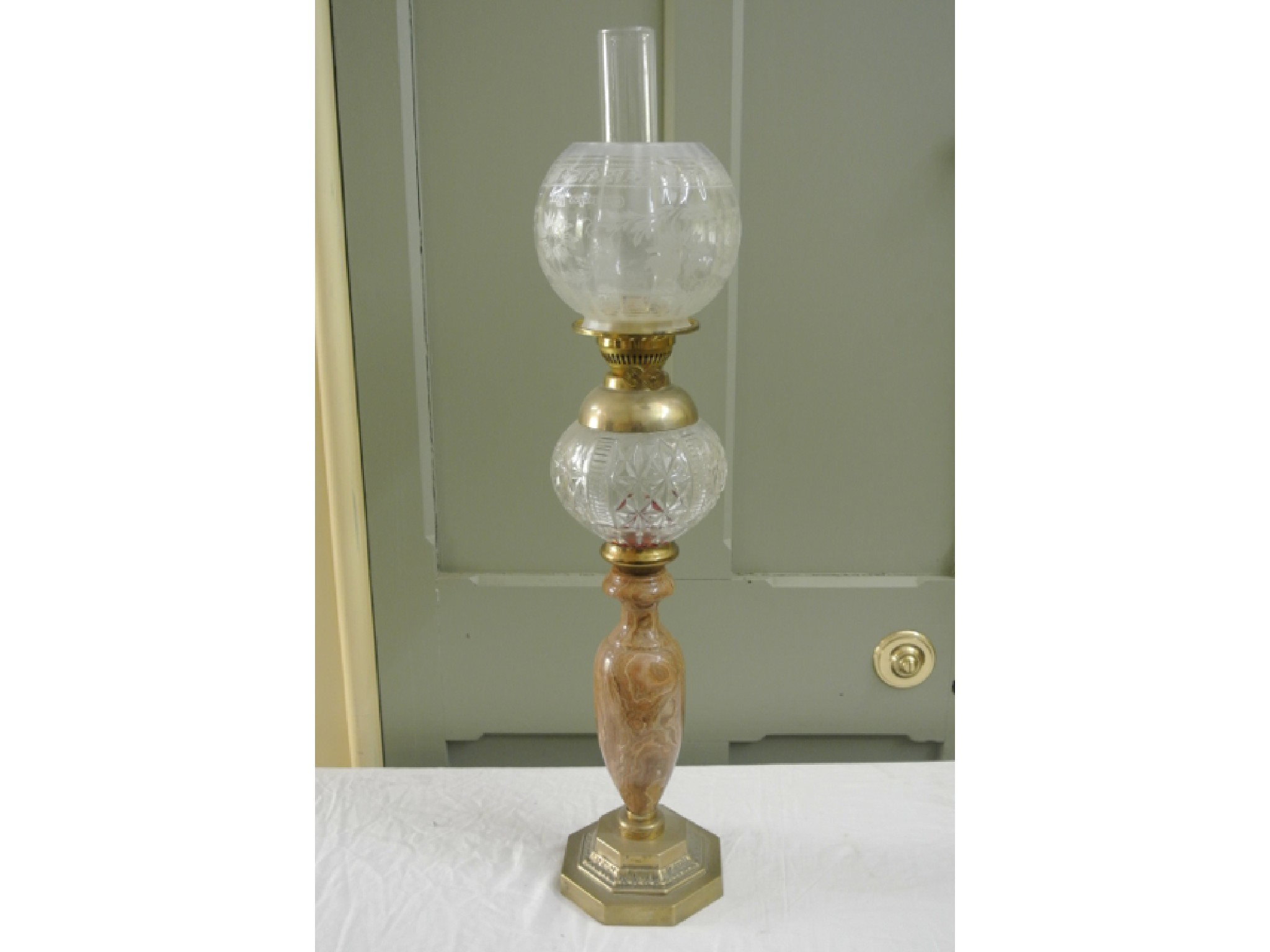 Appraisal: A vintage oil lamp with globular Christopher Wray etched glass