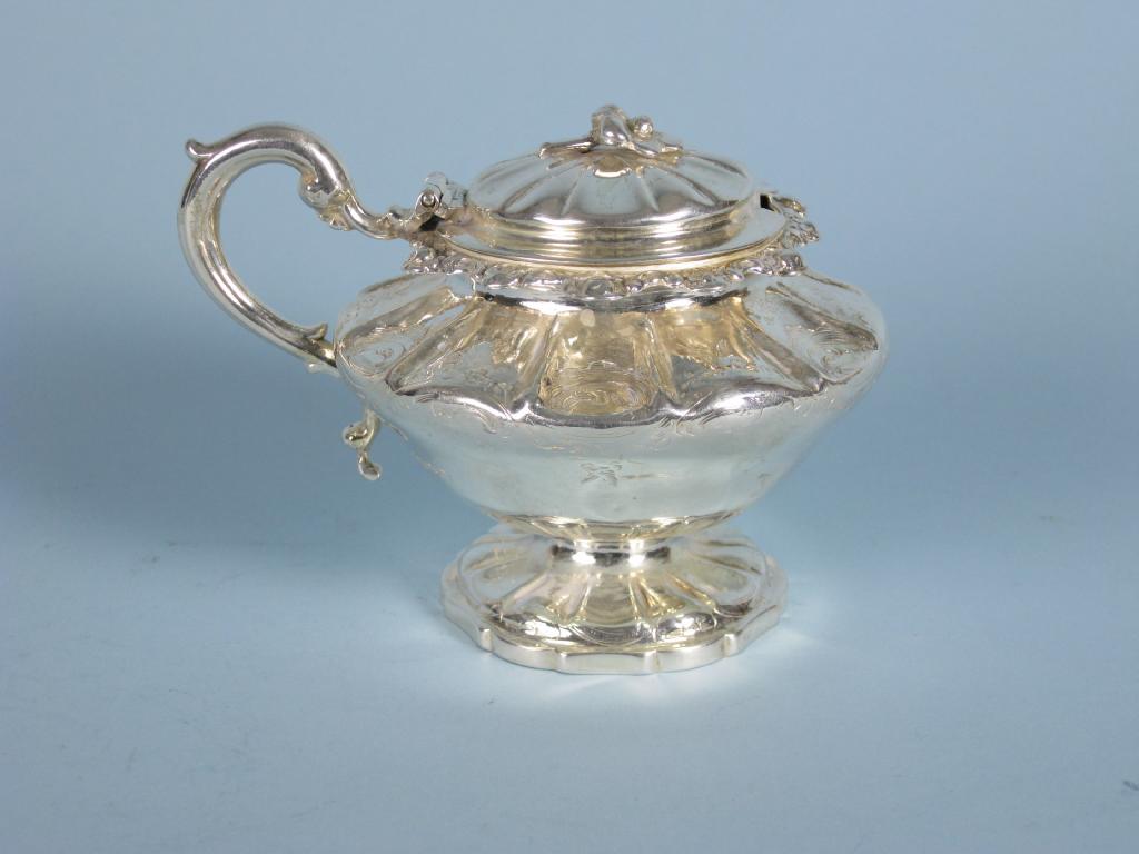 Appraisal: A Victorian Mustard Pot with hinged lid having floral finial