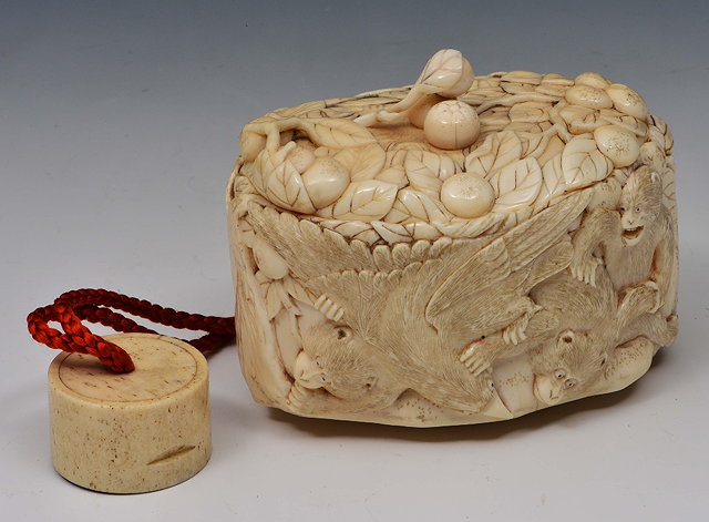 Appraisal: A Japanese ivory tonkotsu th Centurycarved with six monkeys harassed