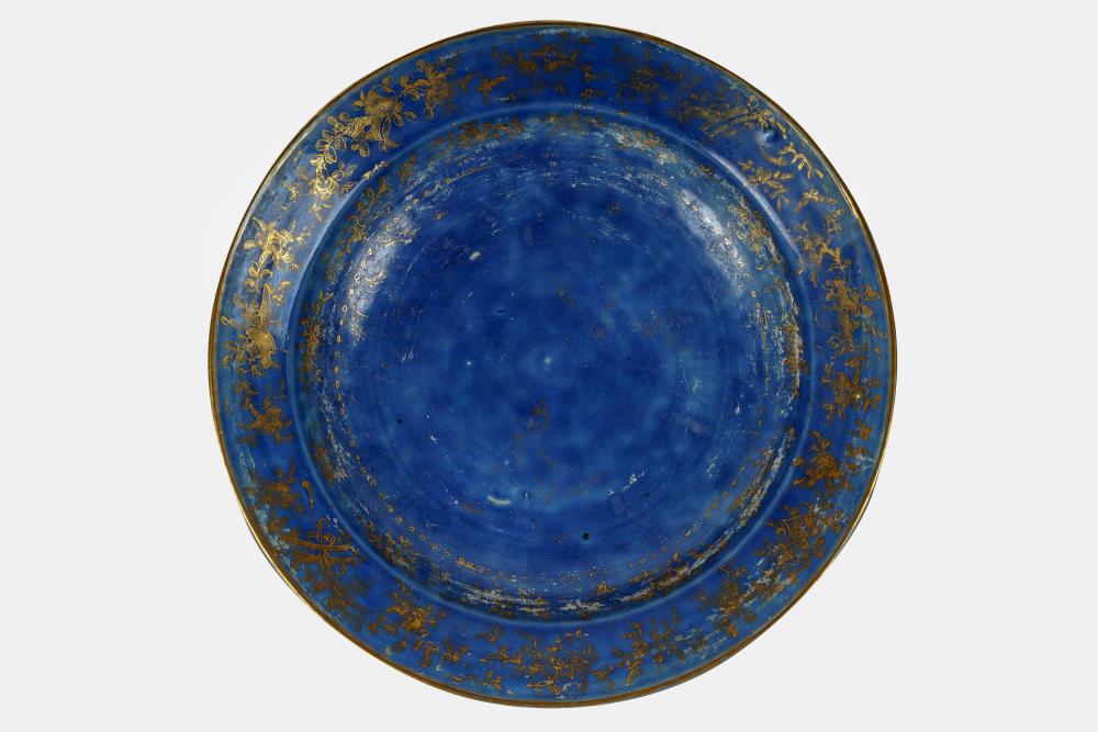 Appraisal: CHINESE BLUE GILT GLAZED CERAMIC CHARGERCondition with loss to decoration