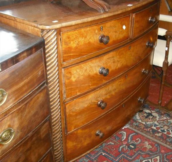 Appraisal: A Victorian mahogany bow front chest of two short and