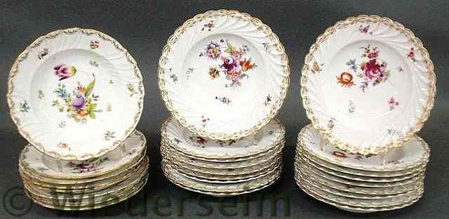 Appraisal: Set of eighteen porcelain soup bowls with colorful floral decoration