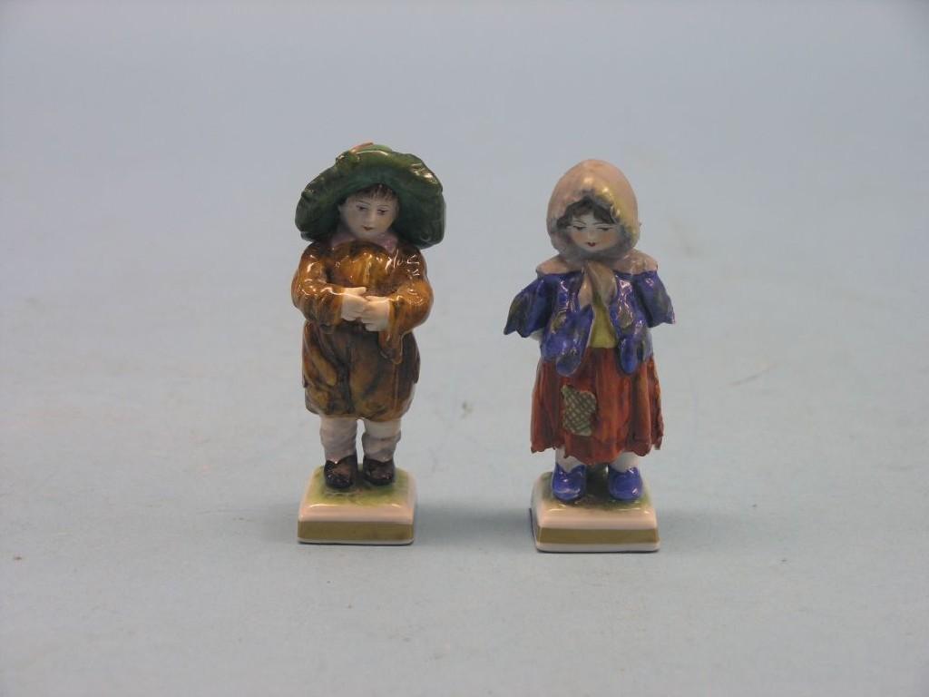 Appraisal: A pair of small German porcelain figures young boy and