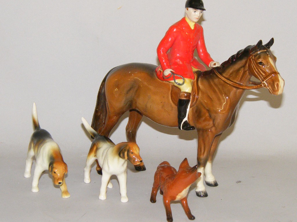 Appraisal: Beswick hunting group comprising a huntsman no high a fox