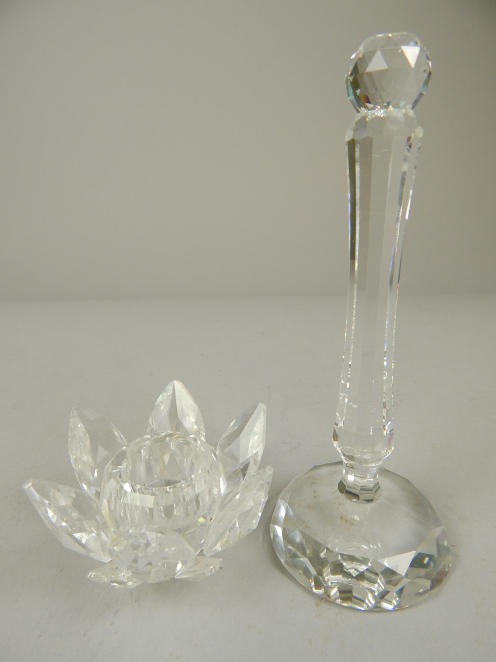 Appraisal: A Swarovski crystal candlestick the sconce in the form of