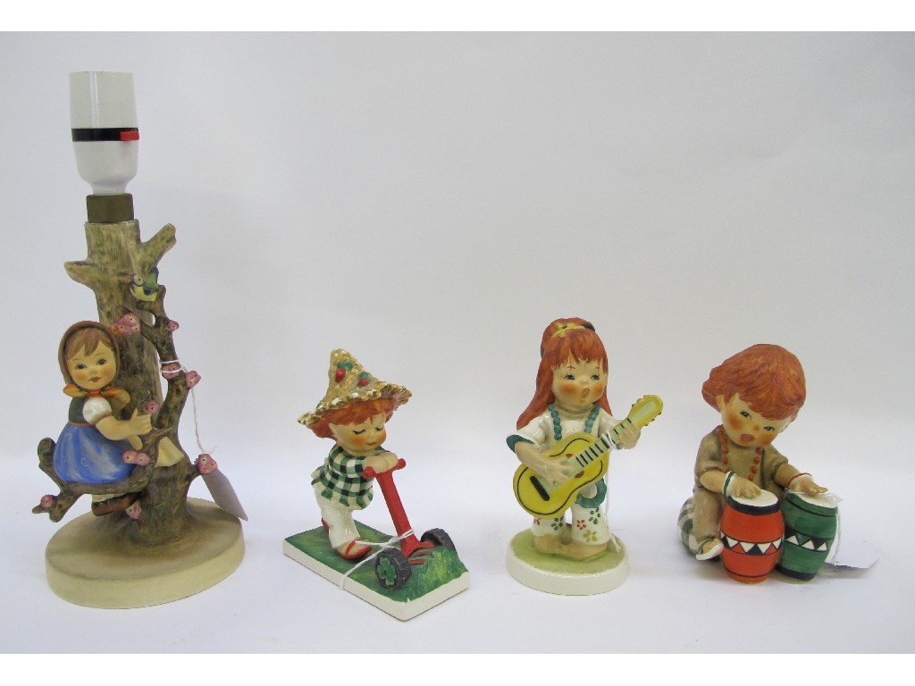 Appraisal: Hummel Apple Tree Girl lampbase and three Goebel red head