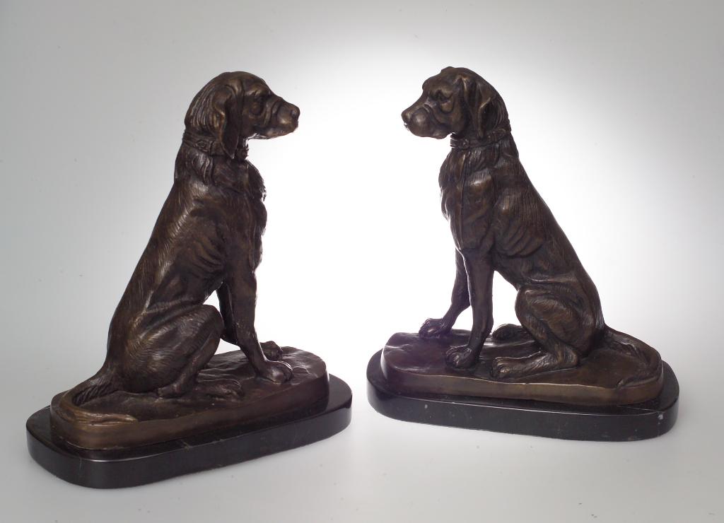 Appraisal: PAIR OF PATINATED BRONZE MODELS OF SEATED DOGS each on