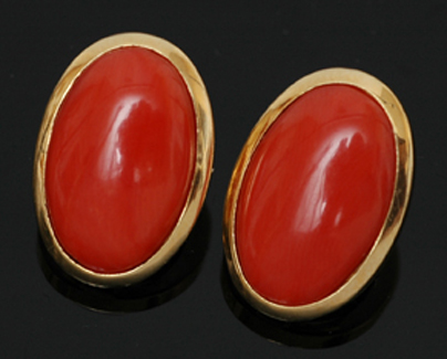 Appraisal: A pair of coral earrings Of oval form set in