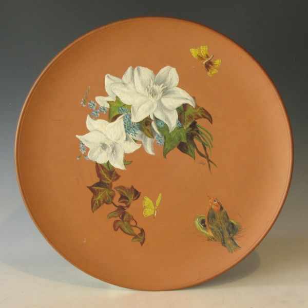 Appraisal: Watcombe Torquay terra cotta plate with hand-painted a bird butterflies