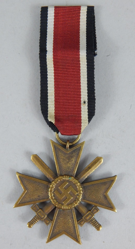 Appraisal: A Third Reich merit cross with swords medal