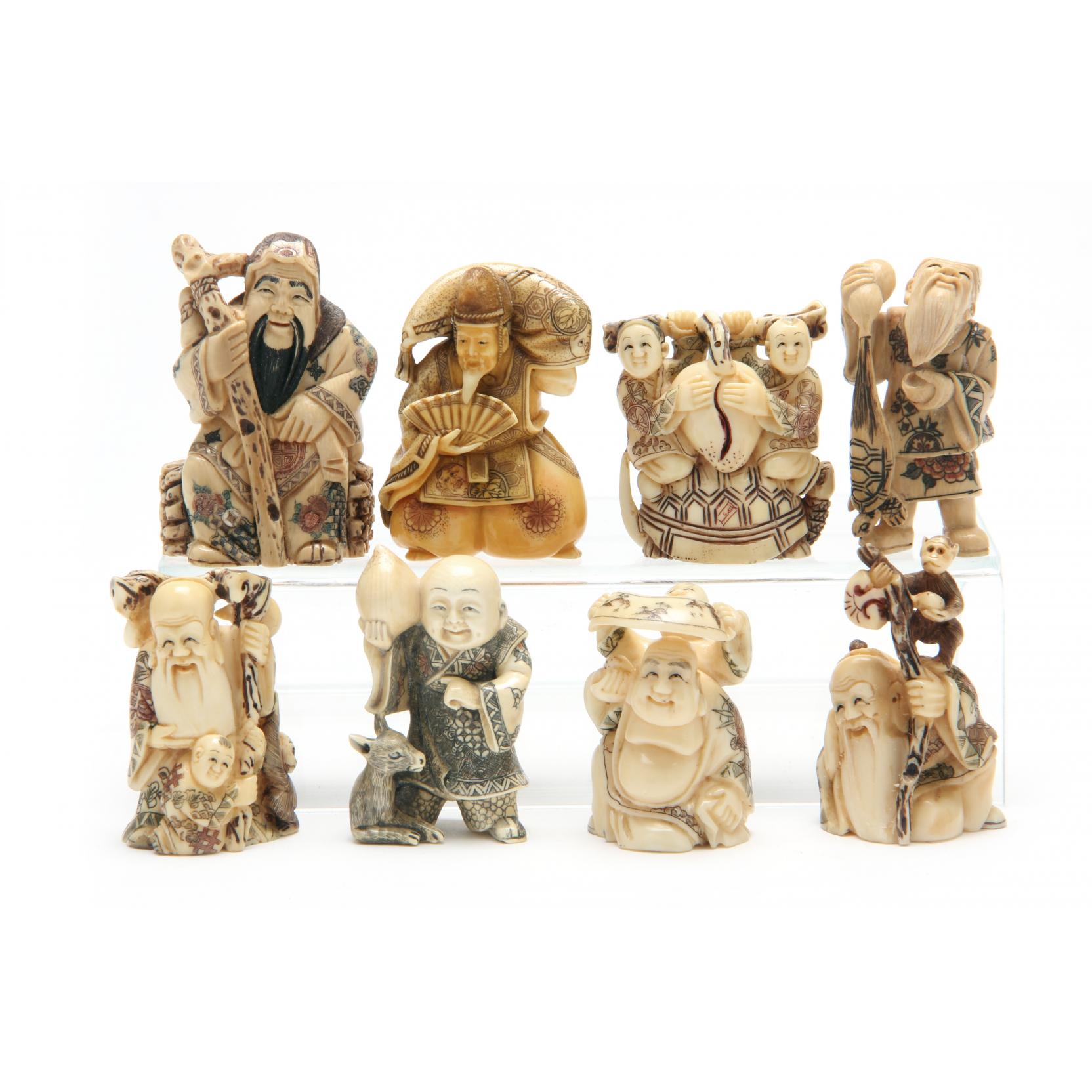 Appraisal: Group of Eight Netsuke of Immortals th century ivory seven