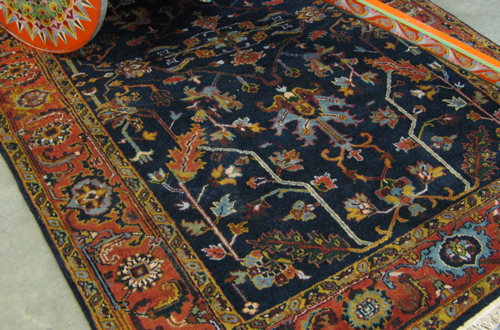 Appraisal: HAND KNOTTED AGRA WOOL CARPET overall stylized floral tracery decoration