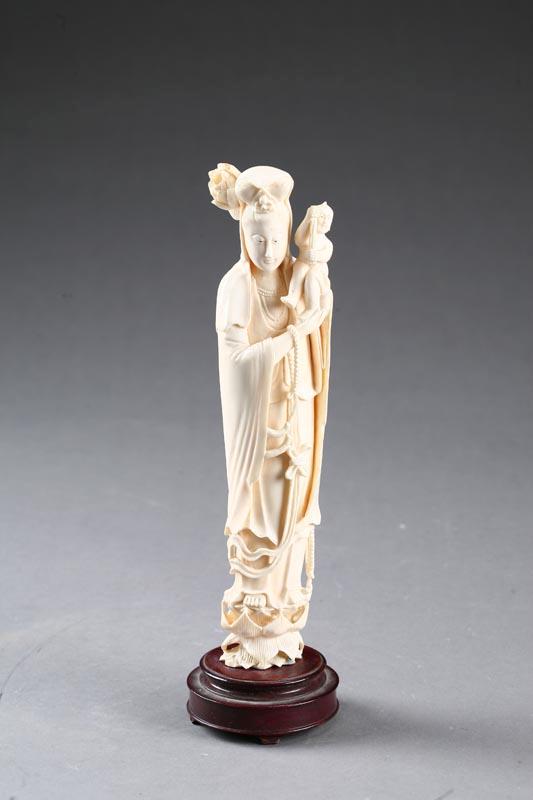 Appraisal: IVORY CARVING OF DEITY China Robed figure with a Buddha