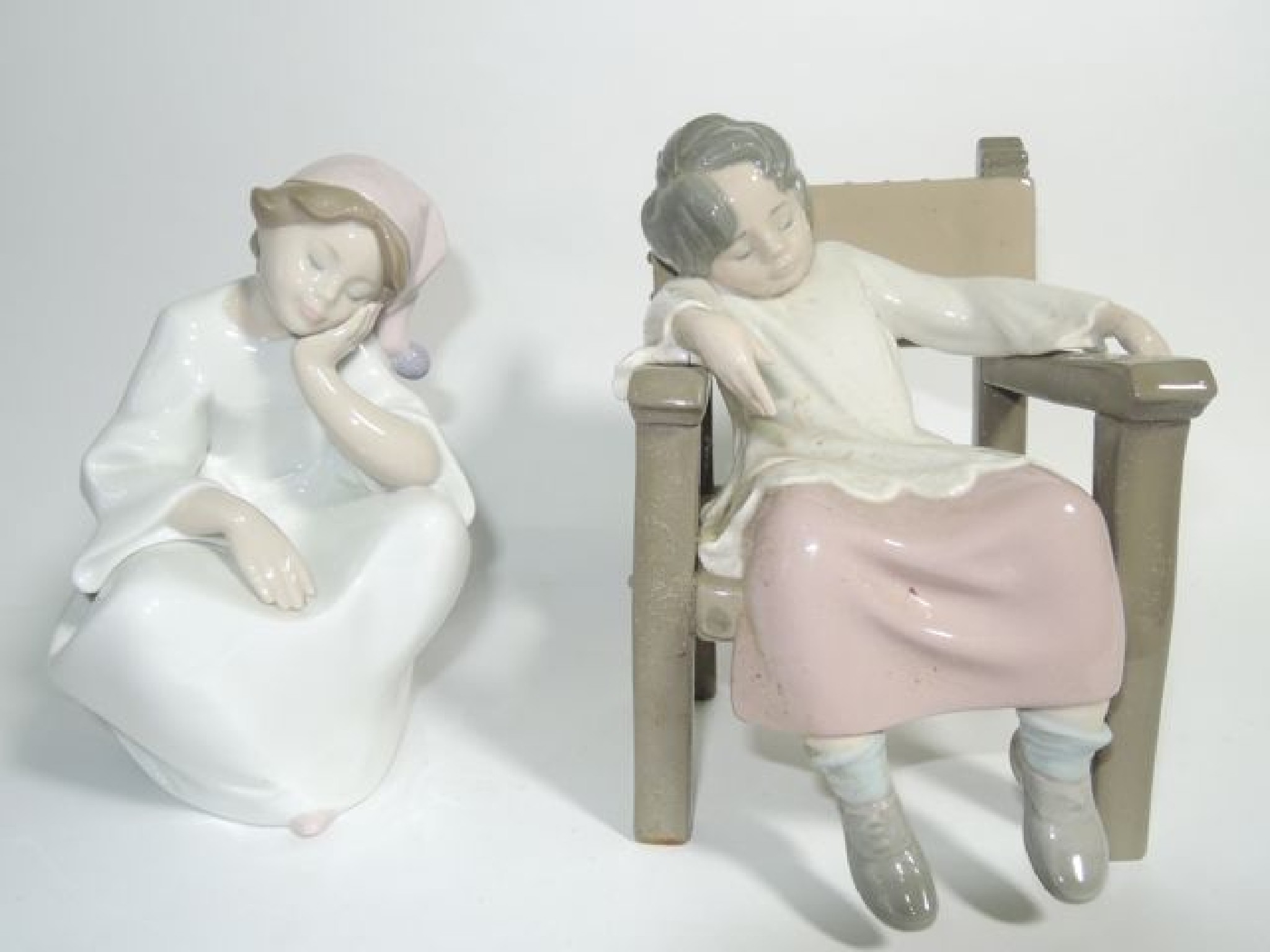 Appraisal: A Lladro figure of a sleeping child seated on a