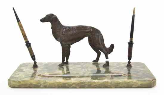 Appraisal: An Onyx and Cast Bronze Desk Set centered with a