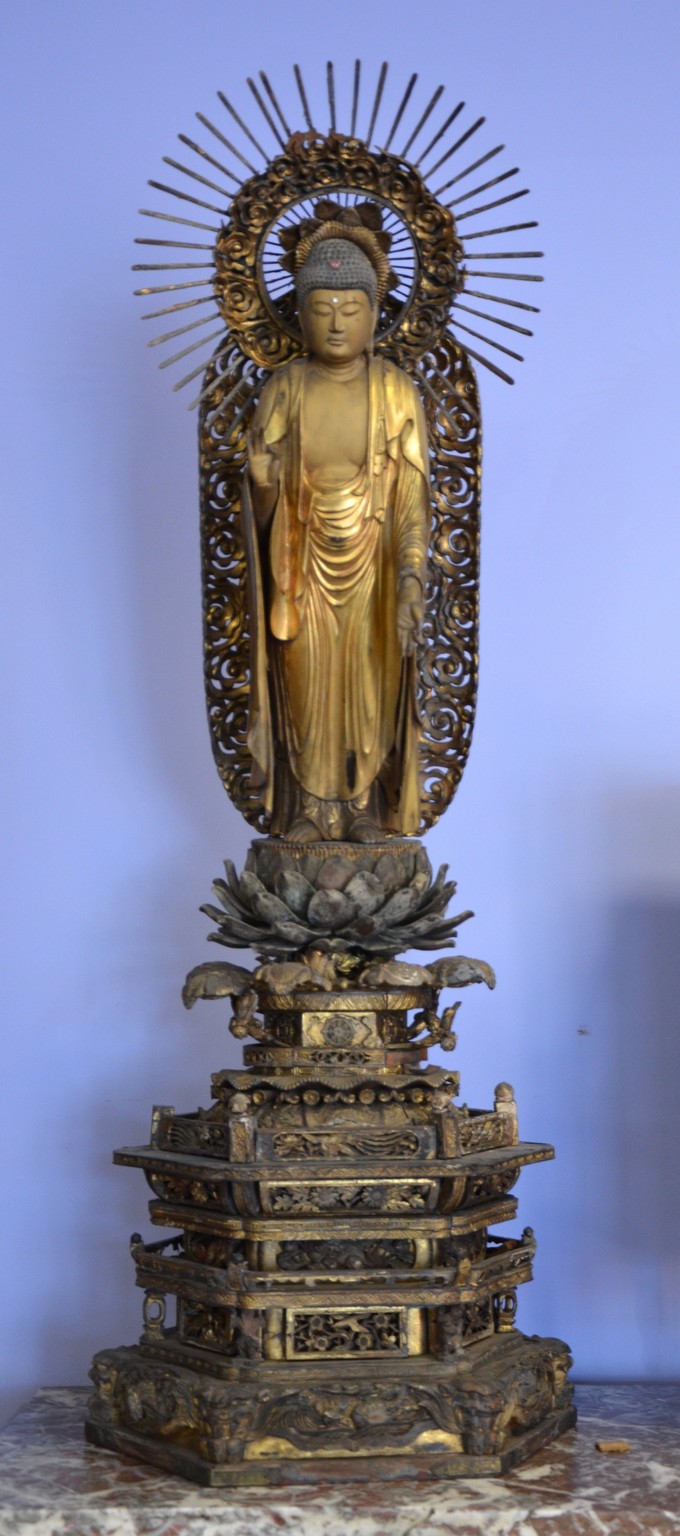 Appraisal: Carved and lacquered Japanese Buddha on ornate multi-level base as