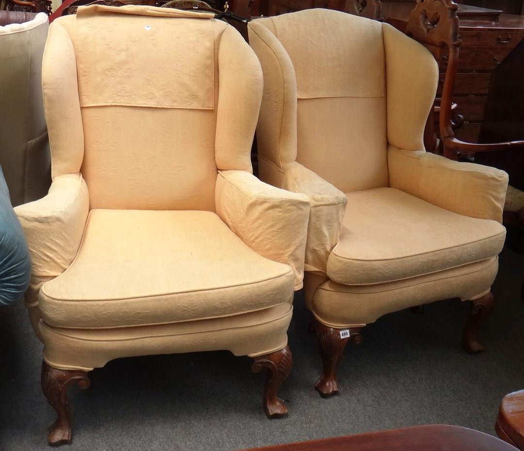 Appraisal: A pair of early th century style wingback armchairs each