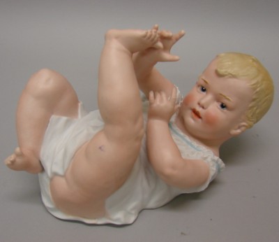 Appraisal: L Heubach type piano baby Marked boy baby on back