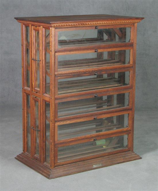 Appraisal: Oak Ribbon Cabinet Circa Six doors on either side Case