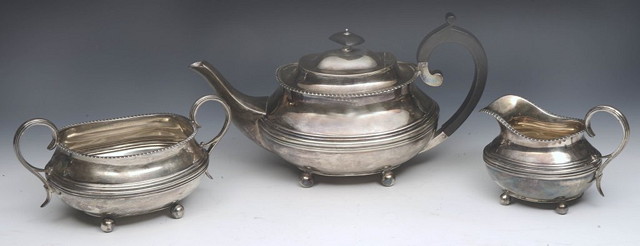 Appraisal: A THREE PIECE SILVER TEA SET comprising teapot milk jug