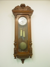 Appraisal: Split column wall clock with brass weights porcelain dial and