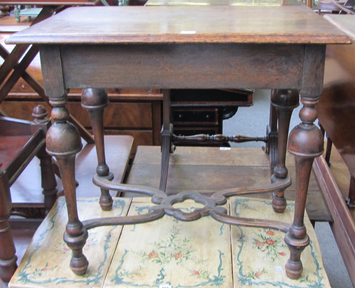 Appraisal: A rectangular oak occasional table of th century design on