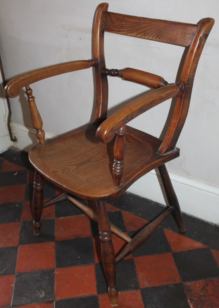 Appraisal: A Victorian oak and ash Windsor type carver chair H-frame