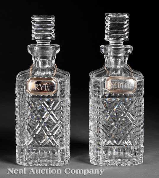 Appraisal: A Pair of Cut Crystal Decanters each body and stopper