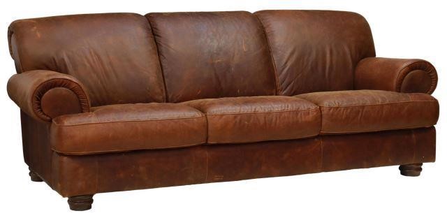 Appraisal: Italian three-seat sofa th c in brown leather upholstery with