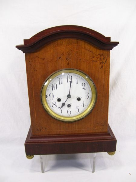 Appraisal: Unghans Mantle Clock Mahogany case clock with inlaid bow and