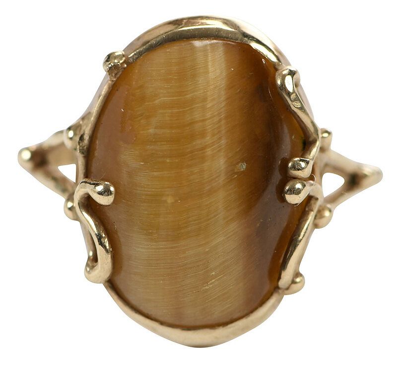 Appraisal: kt Gemstone Ring one oval tiger's eye cabochon approx x