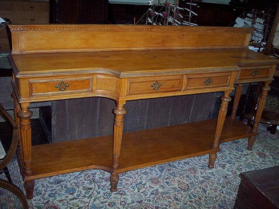 Appraisal: A pine serving table fitted three drawers on fluted taper