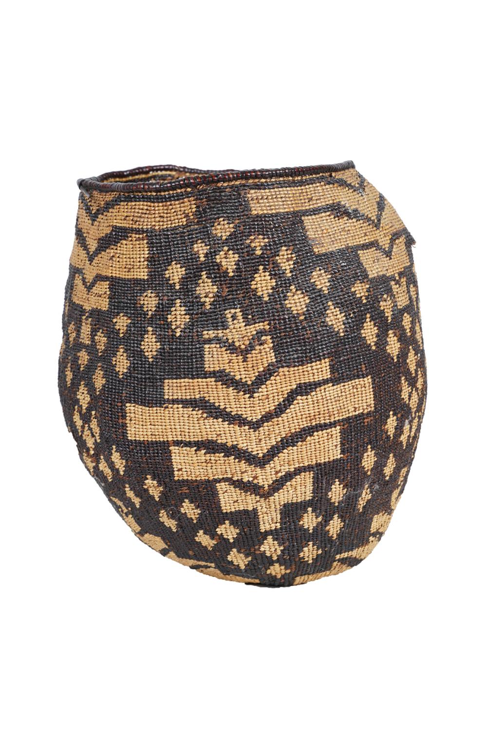 Appraisal: NATIVE AMERICAN STYLE WOVEN BASKETCondition with major loss upper inches