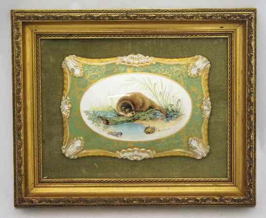 Appraisal: A handpainted pottery plaque of a Otter looking at a