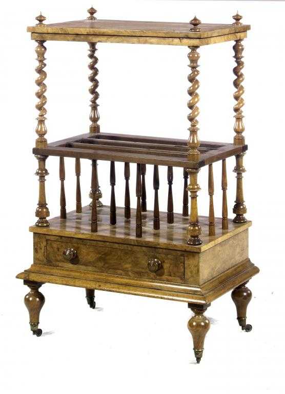 Appraisal: A VICTORIAN WALNUT CANTERBURY with turned finials and spiral pillars