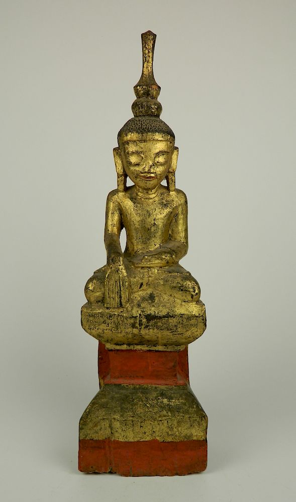 Appraisal: Carved and pained and gilded wood Buddha th thc Carved