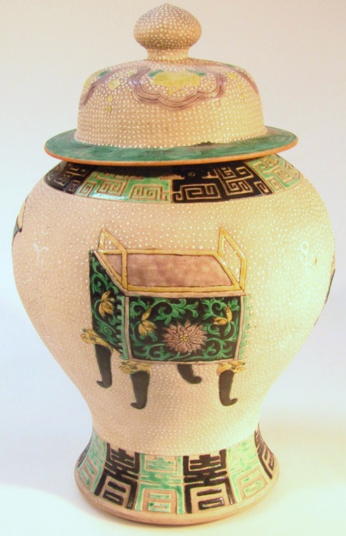 Appraisal: A Chinese earthenware vase with a domed lid with compressed