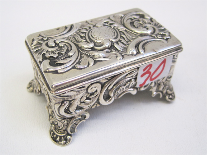 Appraisal: TIFFANY CO STERLING SILVER STAMP BOX ornate pattern raised on