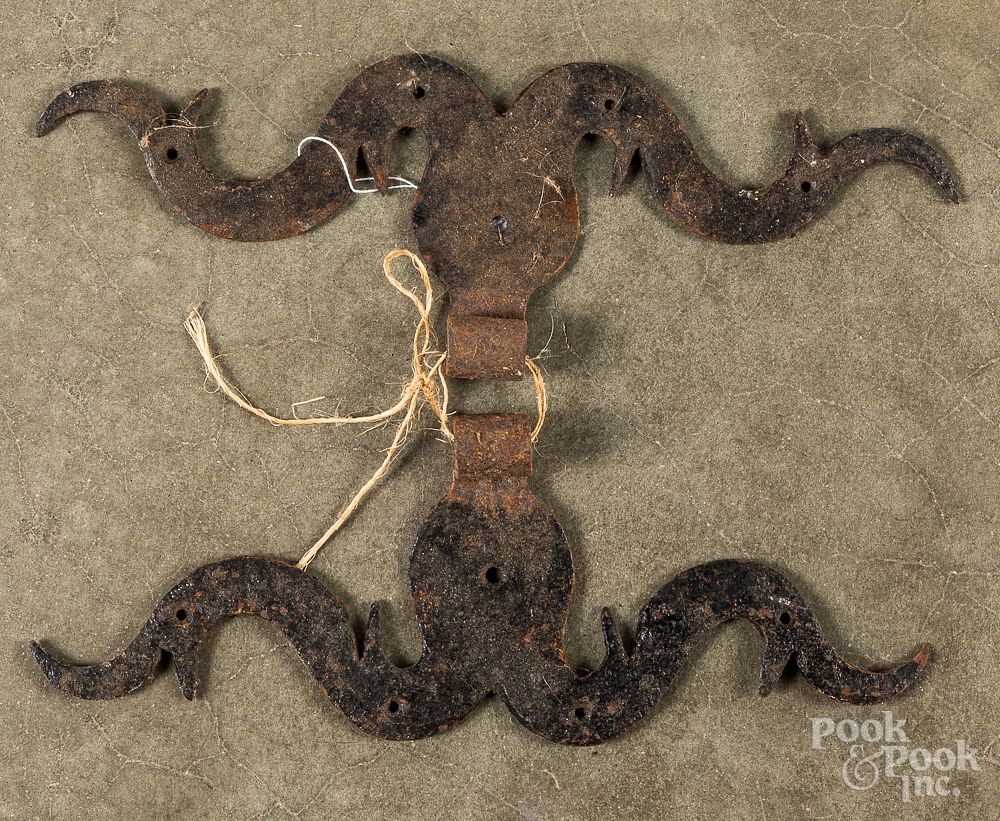 Appraisal: Pair of wrought iron rams horn hinges Pair of wrought