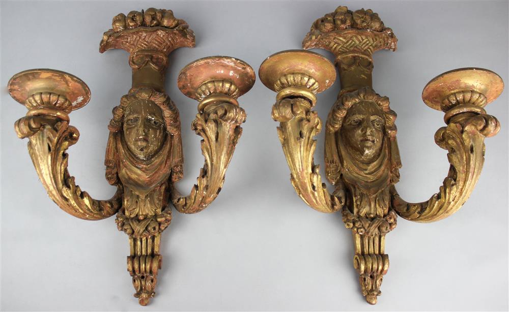 Appraisal: PAIR OF CLASSICAL GILTWOOD TWO-LIGHT SCONCES each with central mask