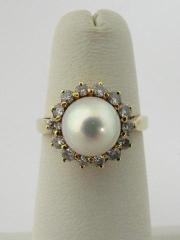 Appraisal: K yellow gold mm pearl ring surrounded by -round brilliant