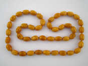 Appraisal: An amber bead necklace beads approx x mm necklace approx