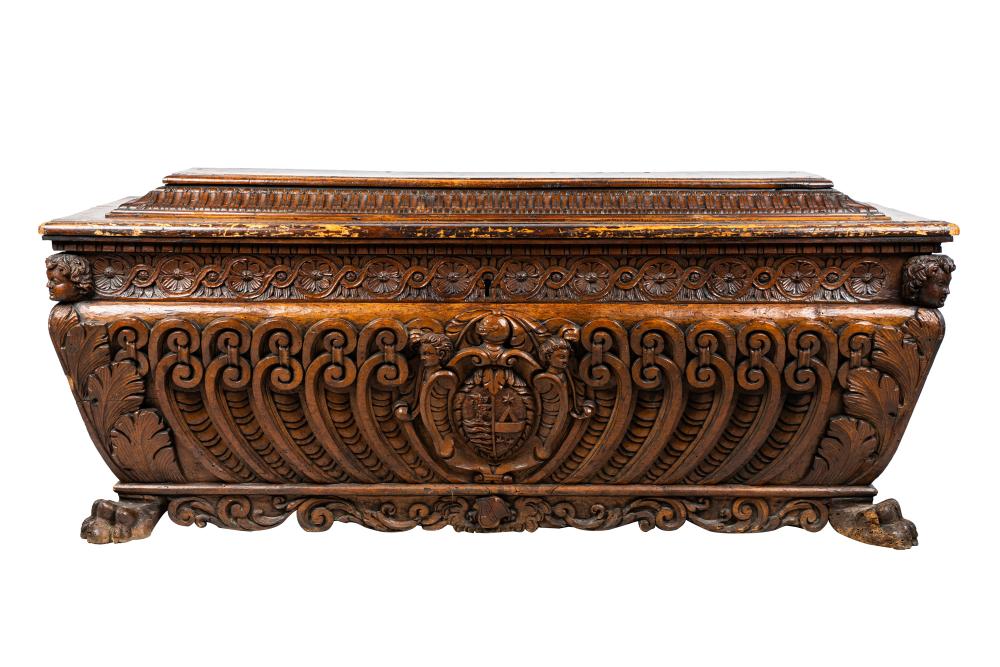 Appraisal: CARVED WALNUT CASSONEthe hinged top enclosing an open interior Condition