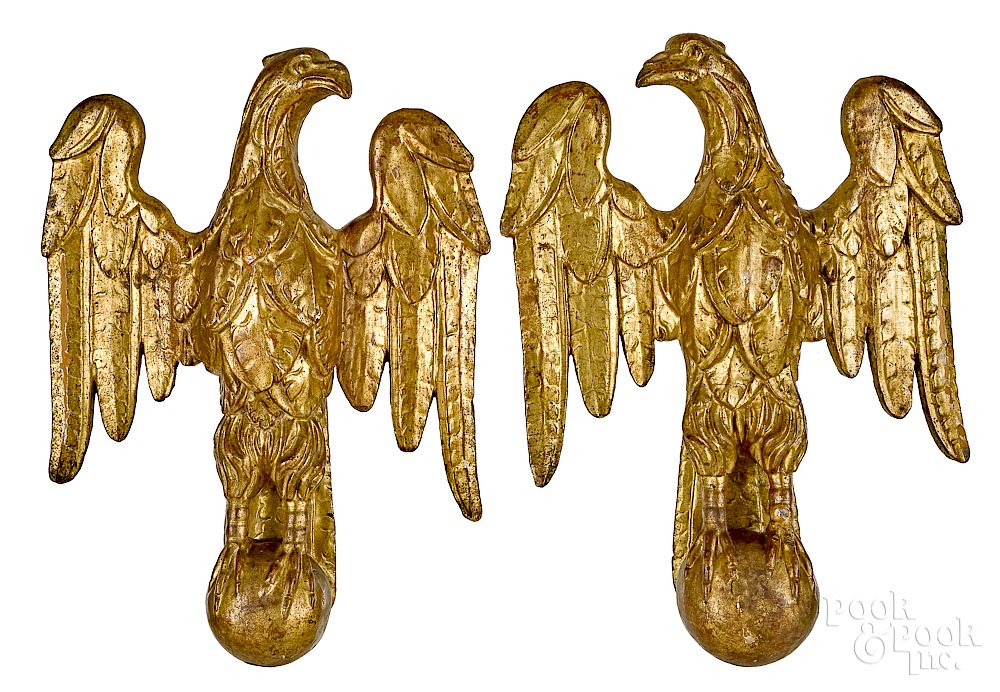 Appraisal: Pair of carved and gilded eagles Pair of carved and