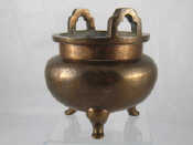 Appraisal: A Chinese bronze censer on three stub legs with engraved